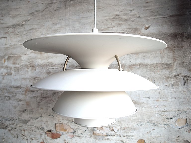 Poul Henningsen 1894-1967. Charlottenborg pendant lamp with four shades of white 
painted metal.