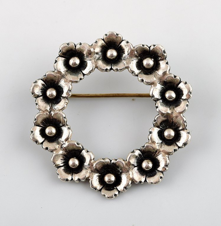 N.E.From sterling silver brooch.