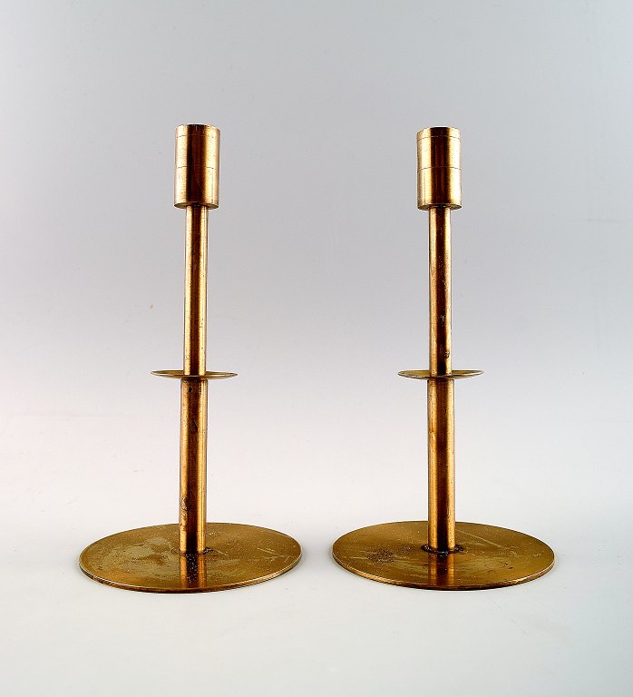 Hans Agne Jakobsson, Markaryd, Sweden, a pair of candlesticks in brass.