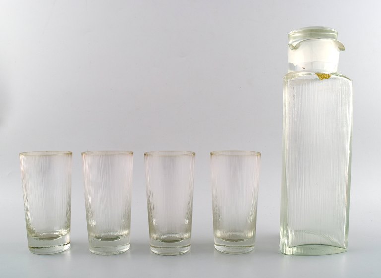 Gullaskruf cocktail set in art glass. Four cocktail glasses and shaker in modern 
design.