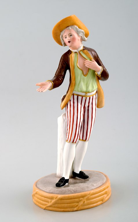 Royal Copenhagen overglaze figurine of gentleman in striped pants. Approximately 
1860.