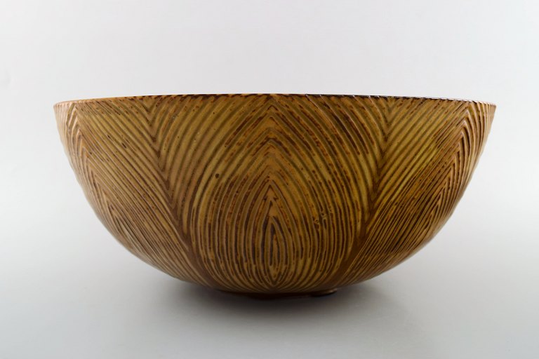 Axel Salto. Plain style, unique dish from his own workshop with greenish and 
brown glaze.