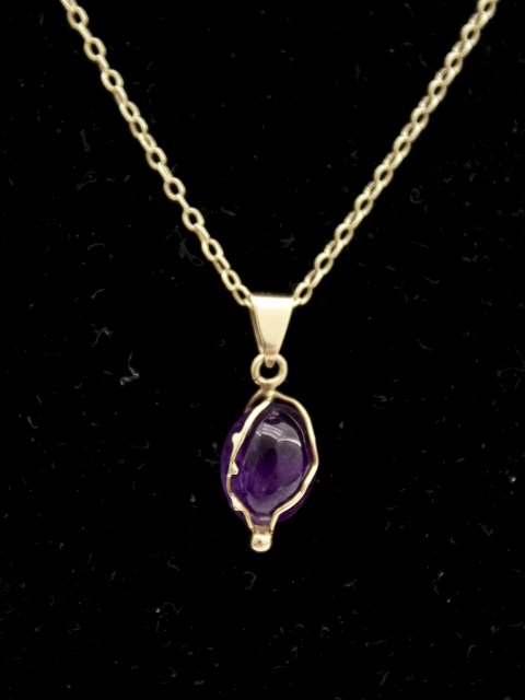 14ct gold necklace a nd pendants with violet sapphire sold