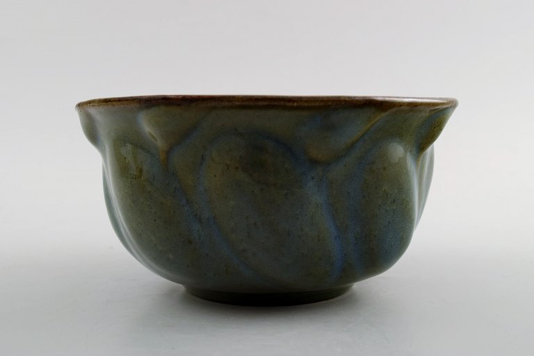 Early Axel Salto for Royal Copenhagen: Stoneware bowl, modeled in organic form, 
decorated with glaze in blue-green tones. 1930s.