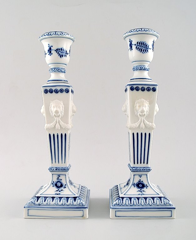 A pair of Royal Copenhagen Blue Fluted plain, candlesticks with lion heads.