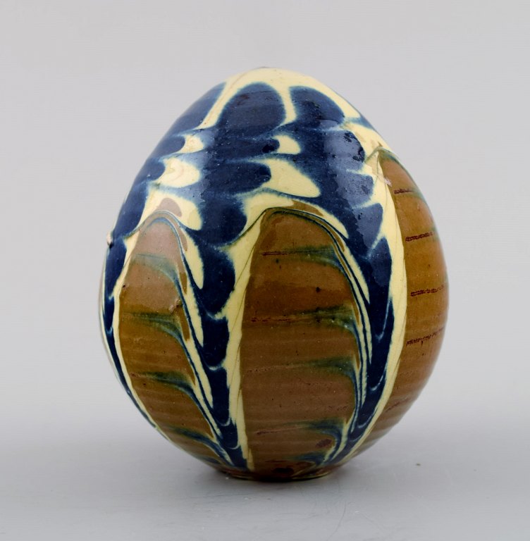 Kähler, Denmark, glazed stoneware, egg with hole in the bottom and top. 1940s.
