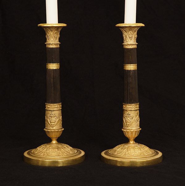 A pair of Empire gilt bronze candelsticks. France circa 1830. H: 28cm