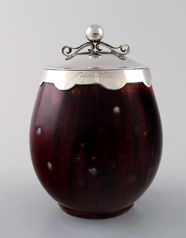 Royal Copenhagen, Georg Jensen, Erik Magnussen:
Jam jar of stoneware decorated with oxblood glaze.