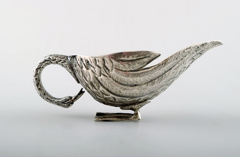 Tyrkiet, flødekande i sølv i form af fugl.
