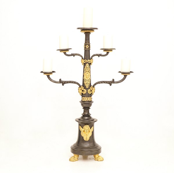 A large gilt bronze candlestick for five candles. France circa 1850. H: 95cm. W: 
66cm