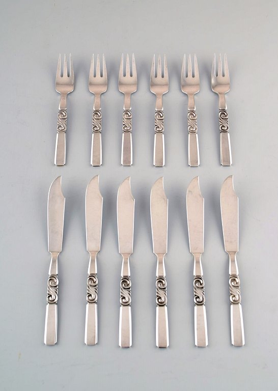 Georg Jensen. Cutlery, Scroll No. 22, Complete Fish Service of Hammered Sterling 
Silver.