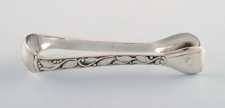 Evald Nielsen No. 30 (leaf pattern), sugar tong in sterling silver.
