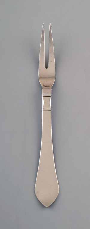 Georg Jensen. Continental roast fork in all silver, silverware, hand hammered.