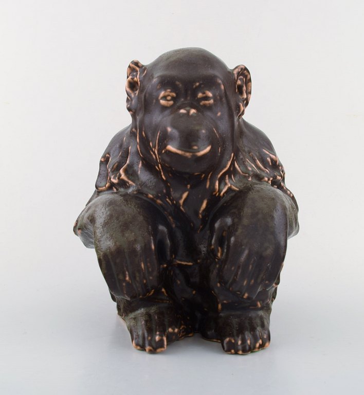 Jean Rene Gauguin for B & G / Bing & Grondahl. Stoneware figure in Sung glaze. 
Sitting monkey. 1940 s.