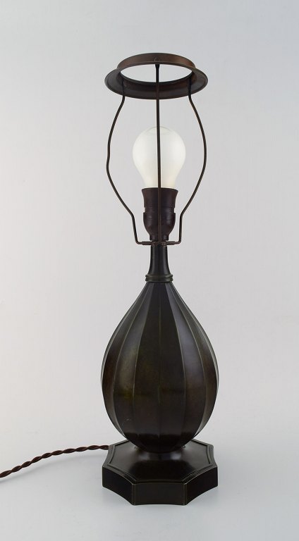 Just Andersen (1884-1943). Table lamp in patinated "disko" metal.
