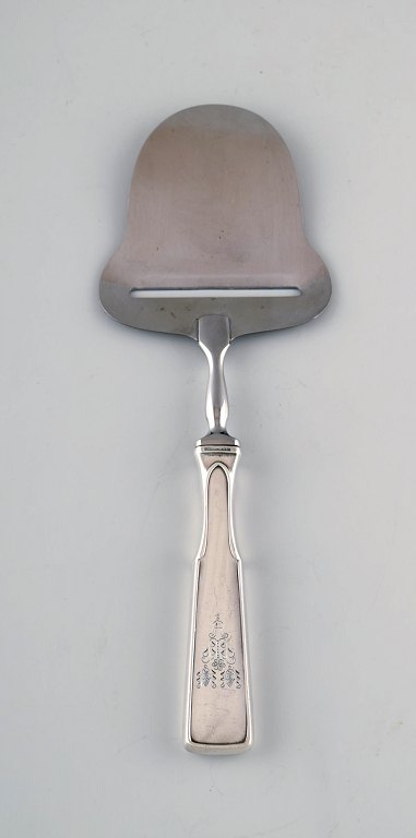 Hans Hansen silverware number 2. Cheese slicer in all silver and stainless 
steel. 
