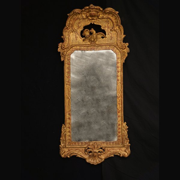 A gilt Rococo mirror. Sweden circa 1750. Size: 108x50cm