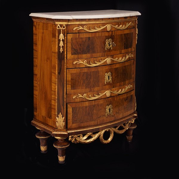 A Northgerman walnut veneered commode with marble top and gilt ornaments. Altona 
circa 1780. H: 97cm. W75cm. D: 40cm