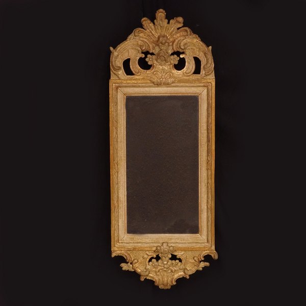 A gilt Gustavian mirror. Sweden circa 1780. 81x30cm