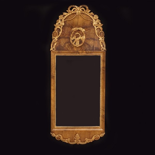 A Louis XVI gilt walnut veneered mirror. Schleswig.Holstein, Northgermany, circa 
1780. 104x41cm