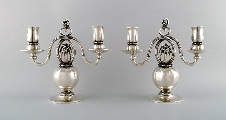 A PAIR OF DANISH SILVER TWO-LIGHT CANDELABRA, DESIGNED BY GEORG JENSEN. 