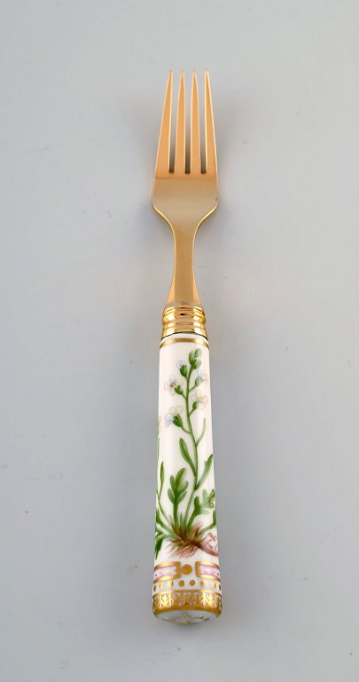 Michelsen for Royal Copenhagen. "Flora Danica" lunch fork made of gold plated 
sterling silver. Porcelain handles decorated in colors and gold with flowers.