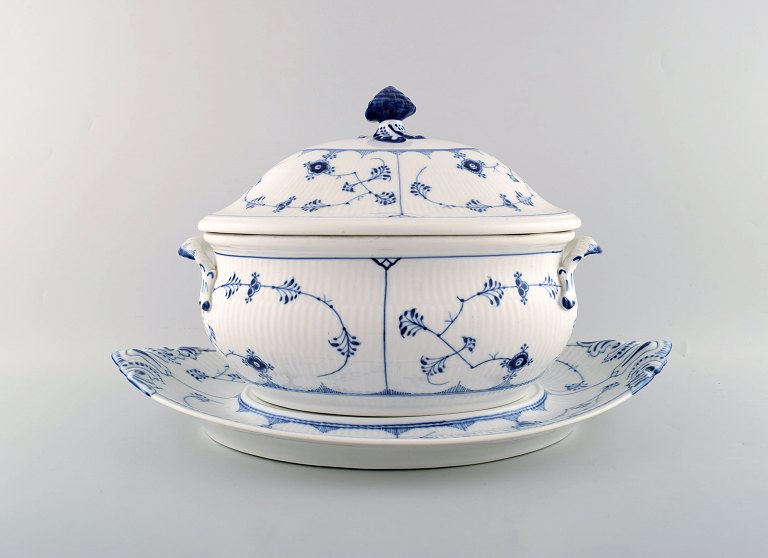 Royal Copenhagen Blue antique fluted plain large lidded tureen # 1/215 on stand. 
Stamped ca 1890.