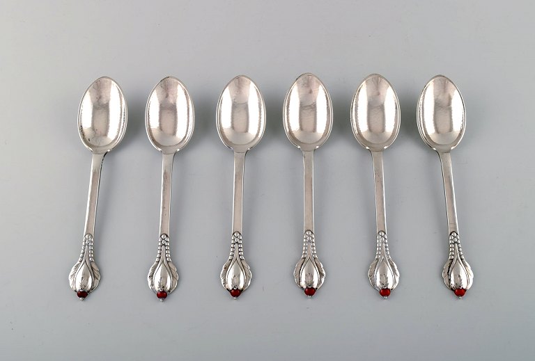 Evald Nielsen number 3 coffee spoon. 6 coffee spoons in hammered silver with 
cabochon coral bead. 1920