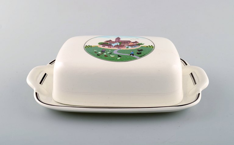 Villeroy & Boch Naif butter container in porcelain decorated with naivist 
village motif.