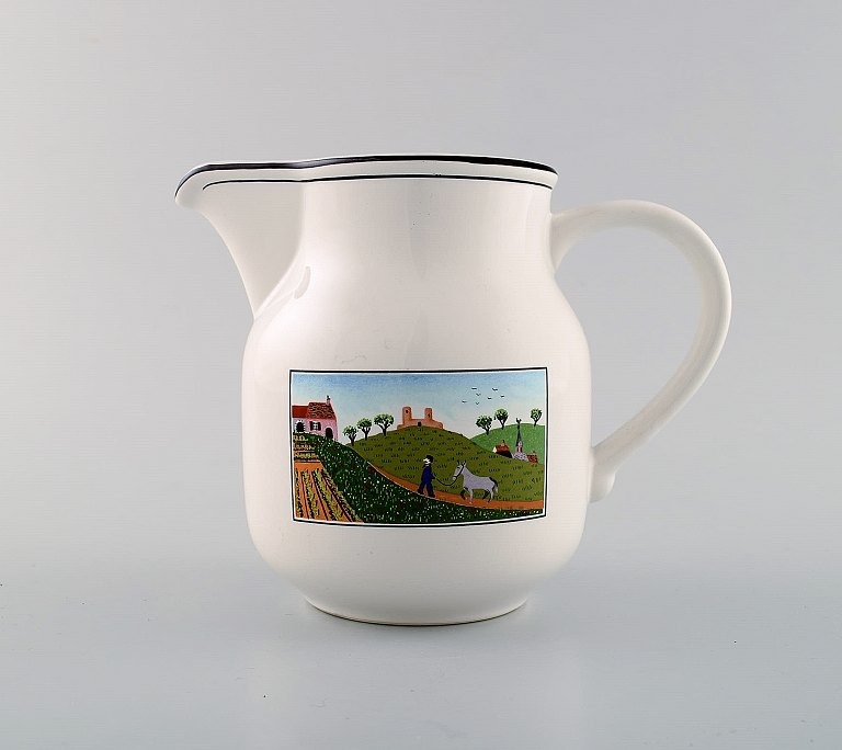 Villeroy & Boch Naif jug in porcelain decorated with naivist village motif.