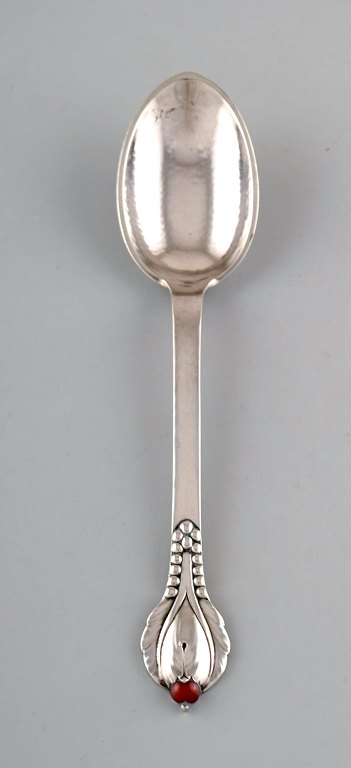 Evald Nielsen number 3, dinner spoon in hammered silver (830) with cabochon 
coral bead. 1920