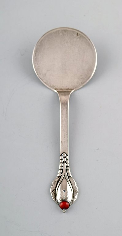 Evald Nielsen number 3, serving spade in hammered silver (830) with cabochon 
stone. 1920