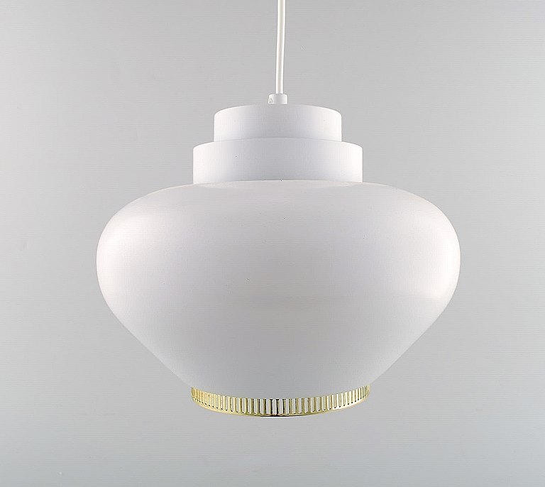 Alvar Aalto. Pendant model A333 made of white lacquered aluminum with a steel 
ring in brass. Produced by Artek. Designed in the 1950