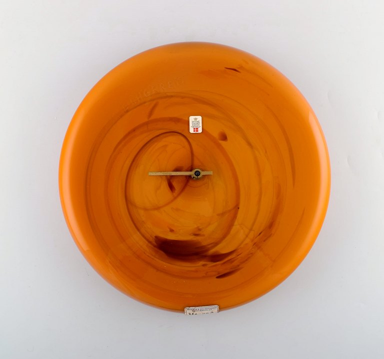 Kastrup / Holmegaard. Large wall clock in orange art glass from Holmegaard