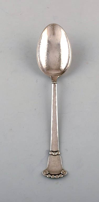 Danish silversmith. "Beaded" spoon in hammered silver. Dated 1930. Three pieces 
in stock.

