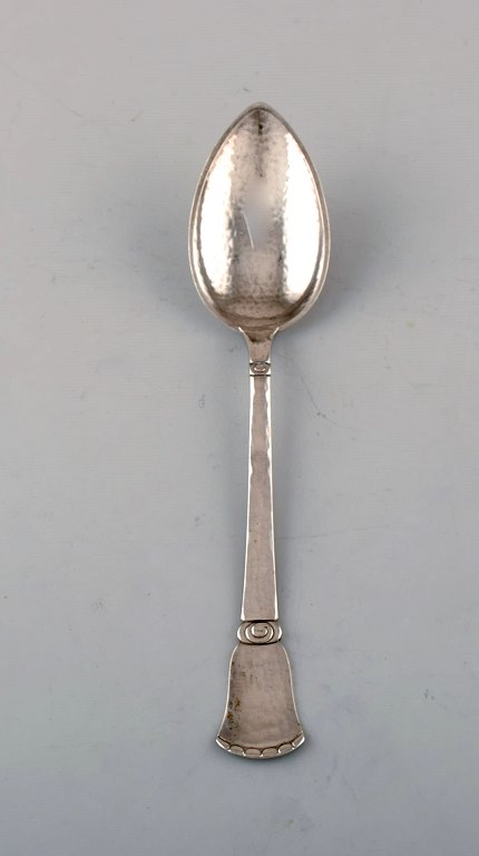 Danish silversmith. "Beaded" spoon in hammered silver. Dated 1923.
