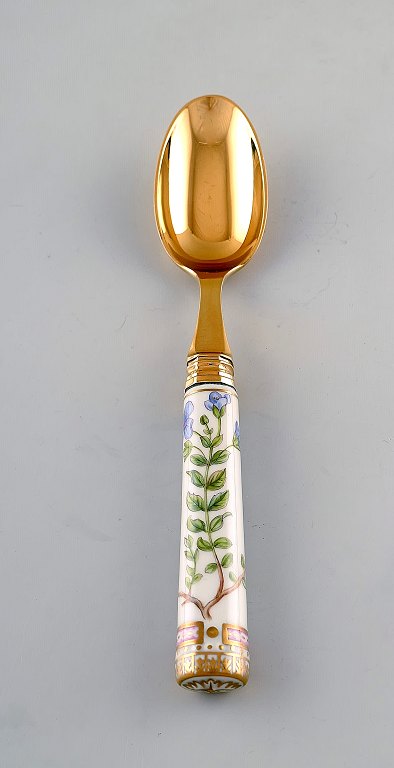 Georg Jensen for Royal Copenhagen. "Flora Danica" dinner spoon of gold plated 
sterling silver. Porcelain handle decorated in colors and gold with flowers.