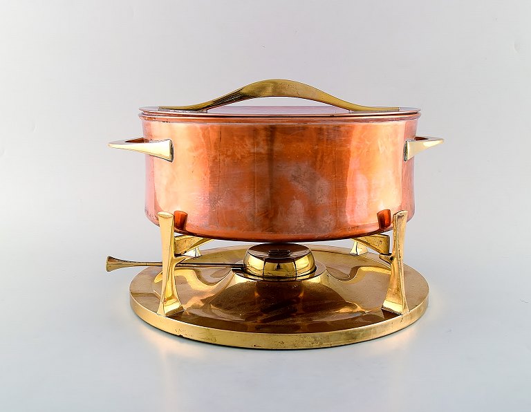 Jens H. Quistgaard. Fondue pot in brass and copper pot on stand with burner.