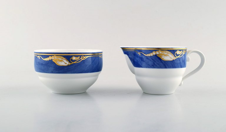Royal Copenhagen. Set of "Magnolia" creamer and sugar bowl. Late 20th century.
