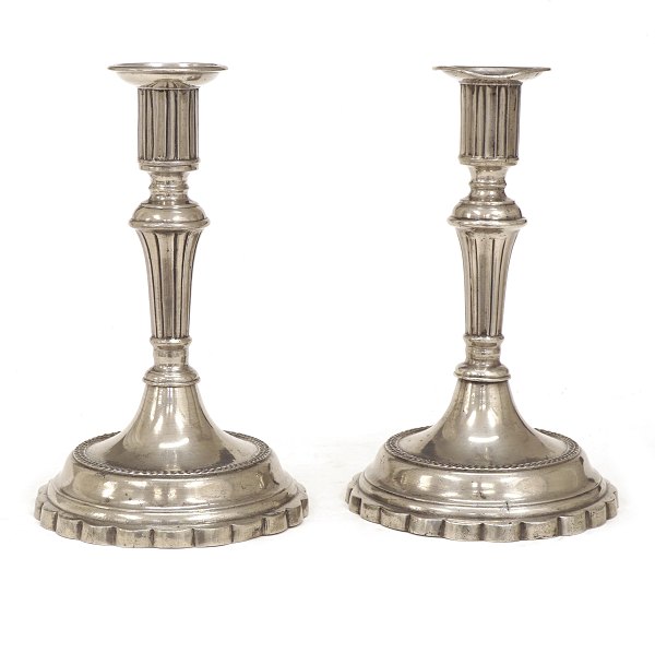 A pair of late 18th century German pewter candle sticks. H: 20cm