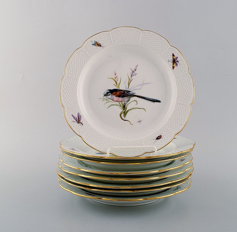 Set of eight Meissen plates. Hand painted with birds and insects. Early 20th 
century.
