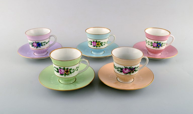 Five early Bing and Grondahl coffee cups with saucers. Hand-painted flower 
decoration and overglaze. Ca. 1920.
