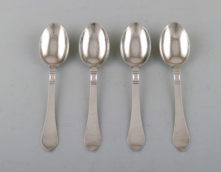 Georg Jensen "Continental" cutlery. Four dessert spoons in hammered sterling 
silver.
