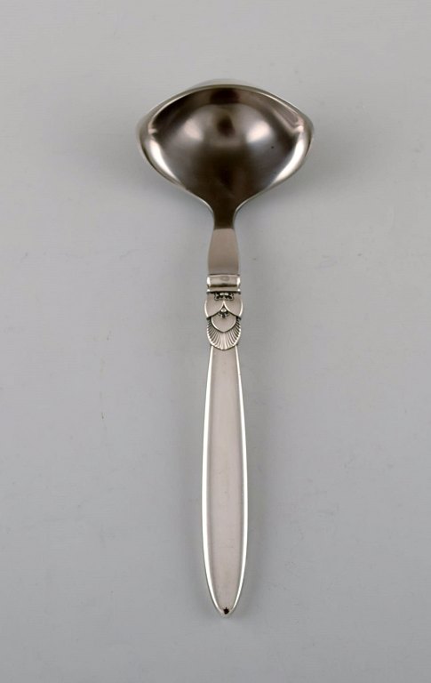 Georg Jensen "Cactus" sauce spoon in sterling silver and stainless steel.
