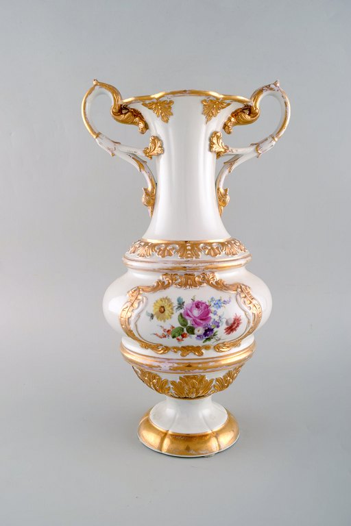 Large antique Meissen vase with handles in hand-painted porcelain with flowers 
and gold decoration. Late 19th century.
