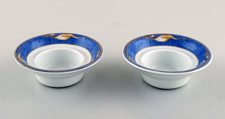 Two Royal Copenhagen "Magnolia" tealight holders. Late 20th century.
