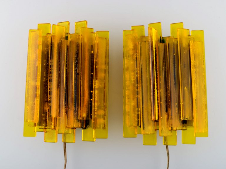 A pair of Scandinavian designer wall lamps in art glass. 1960