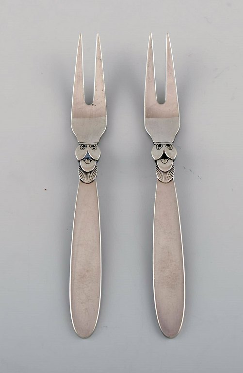 Two Georg Jensen Cactus cold meat forks in sterling silver.
