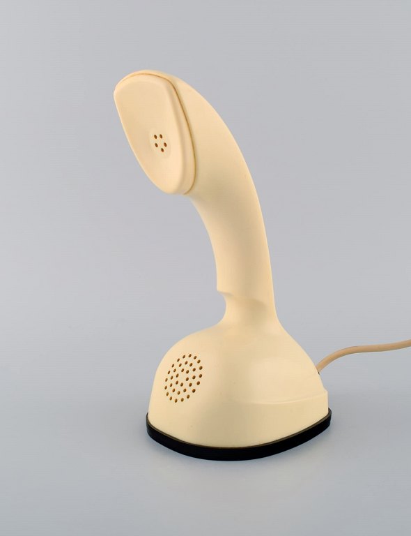 Ericsson Cobra phone in cream-colored plastic with turntable at the bottom. 
Swedish design icon, 1960