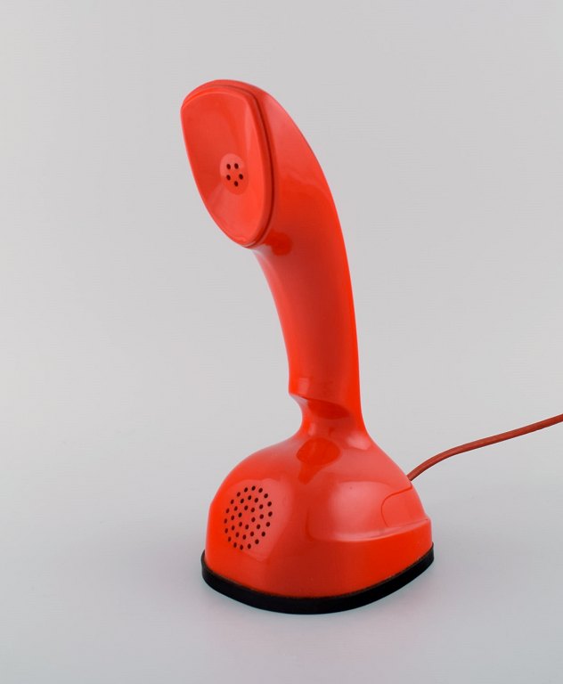 Ericsson Cobra phone in red plastic with turntable at the bottom. Swedish design 
icon, 1960
